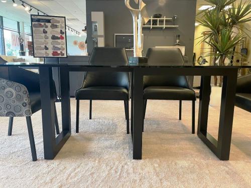 Glass Top Dining Table With Geometric Wood Base